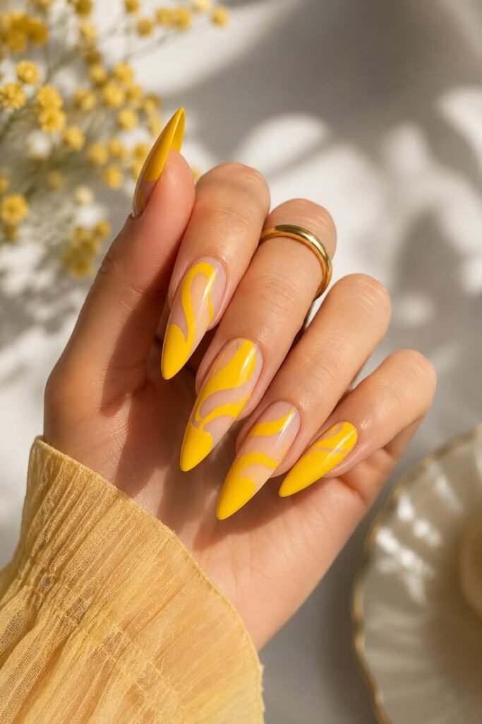 Bold Yellow Abstract Swirl Stiletto Nails