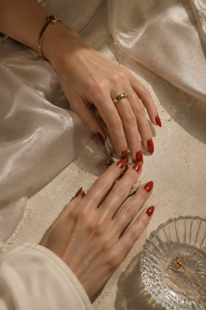 Red Marble Art Nails With Satin Elegance
