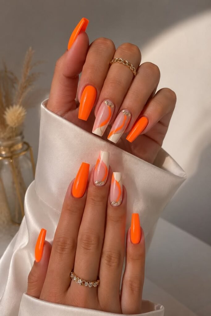 Neon Orange Swirl Coffin Nails With Rhinestones