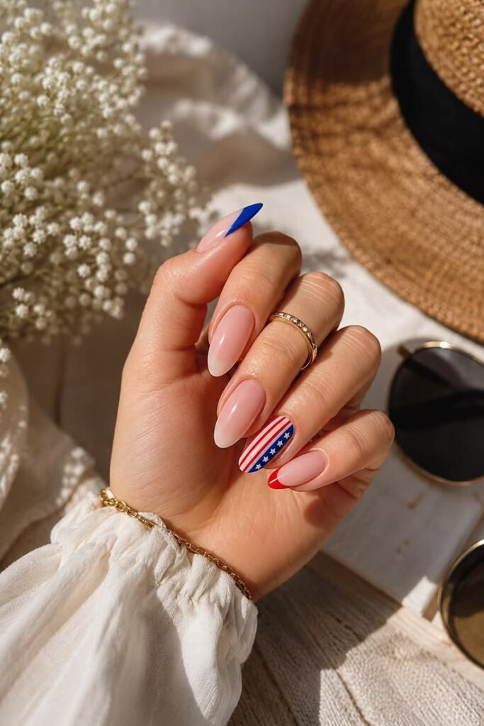 Nude Almond Nails With a Single Flag Accent
